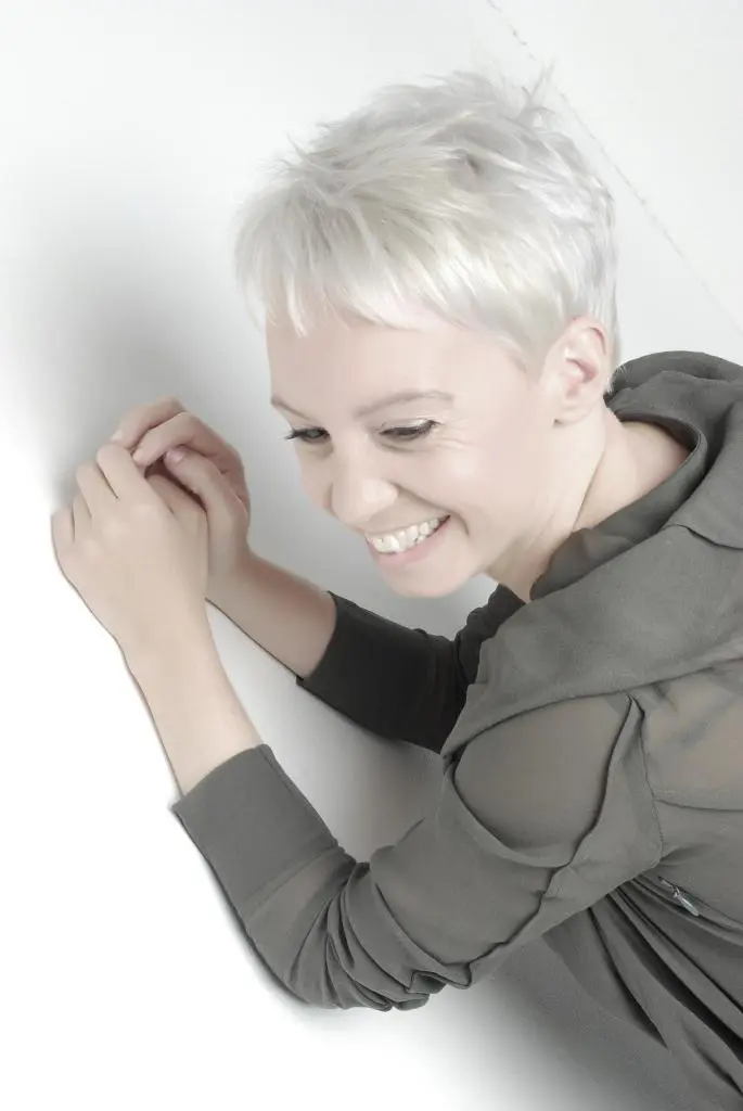 Brown hair smiling girl lying in the massage