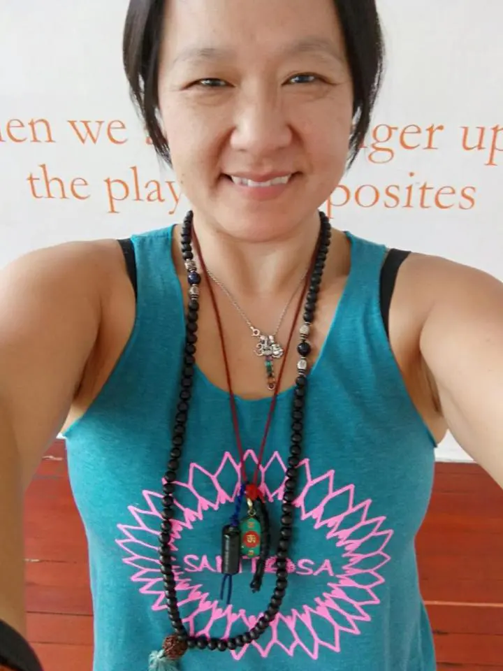 A Korean chiropractic teacher wearing necklaces