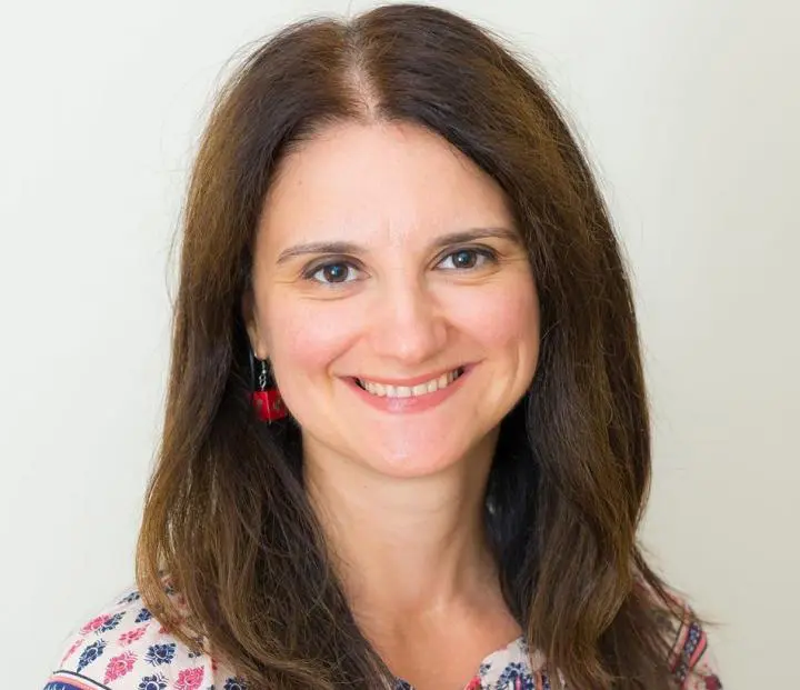 Long and thick-haired lady feeling happiness after doing a massage