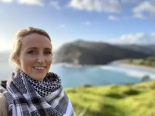30-year-old woman photo capturing the beauty of the lake with mountain | Therapy Teacher Training
