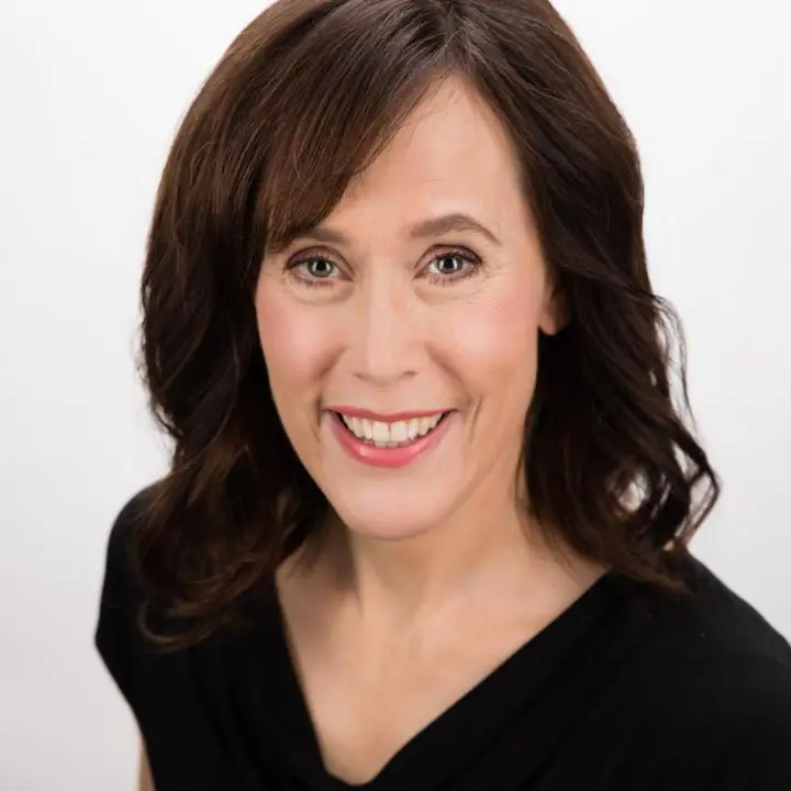 A pretty adult lady wearing a black massage dress