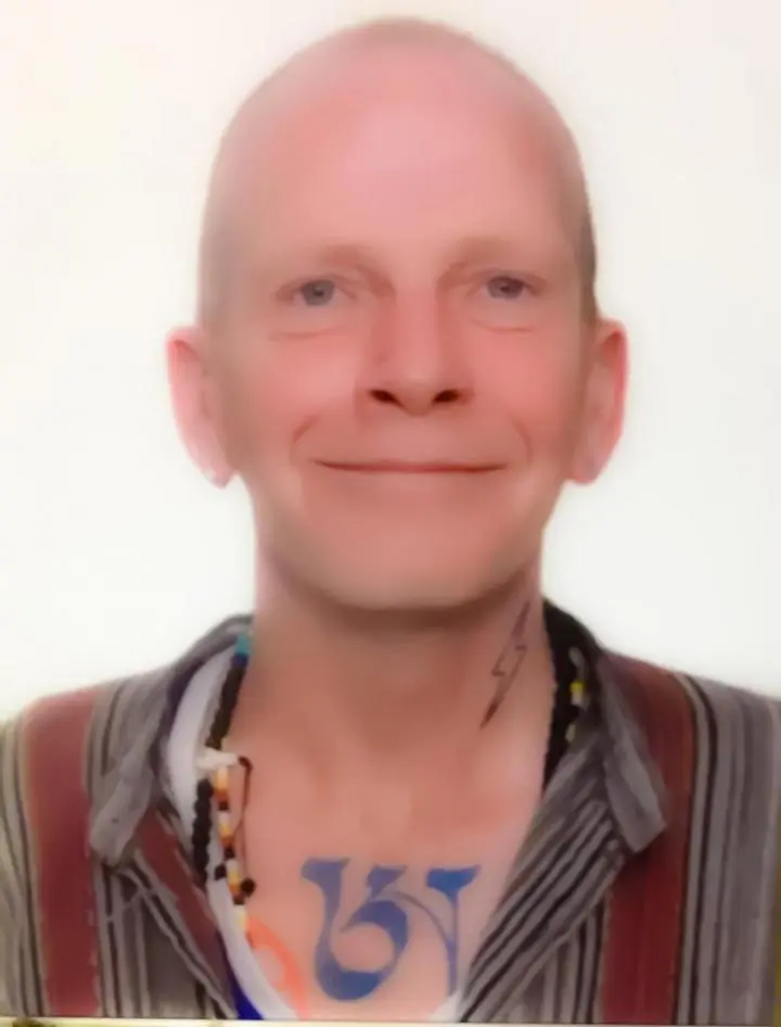 A bald man is very rejoicing after seeing Yoga Nidra Network Platform