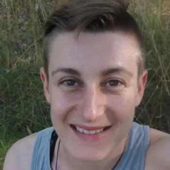 A smiley man standing in bushes | Fitness Interventions