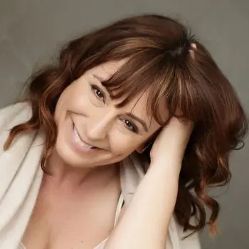 A woman is very happy after having a yoga massage