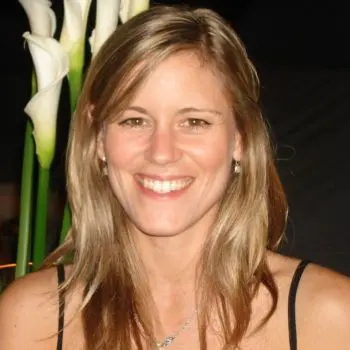 A pretty woman is very happy after doing a massage, with their backside keeping a white flower