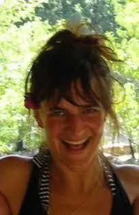 She is lovely smiling and her hair scattered