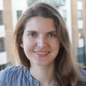 A pretty European girl her long hair blowing in the wind, feeling happy after doing a massage