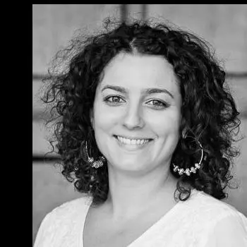A Smiling curly hair girl with black in white photo