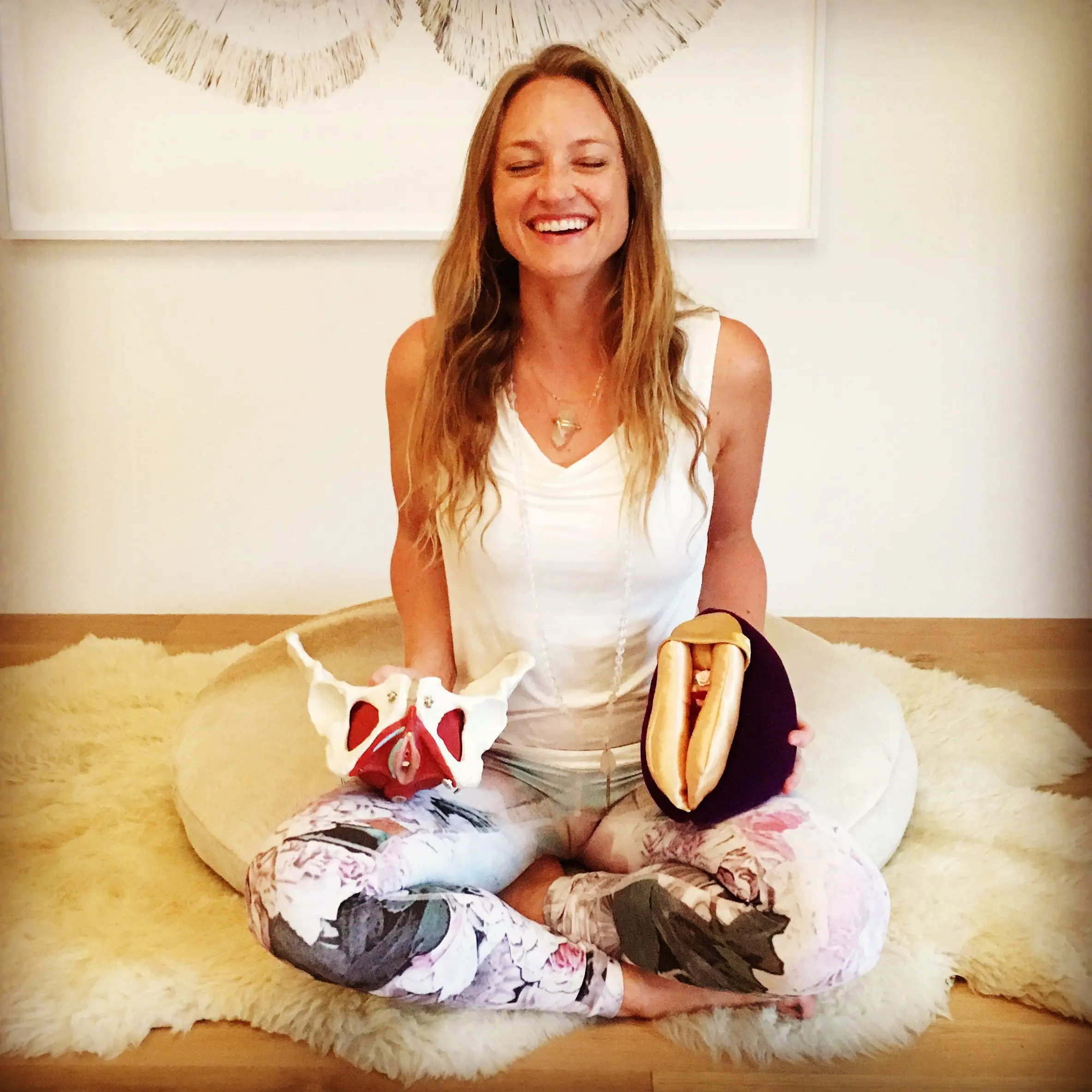 A girl setting in a meditative yoga pose, with a Nidra's instrument blooming in front of her