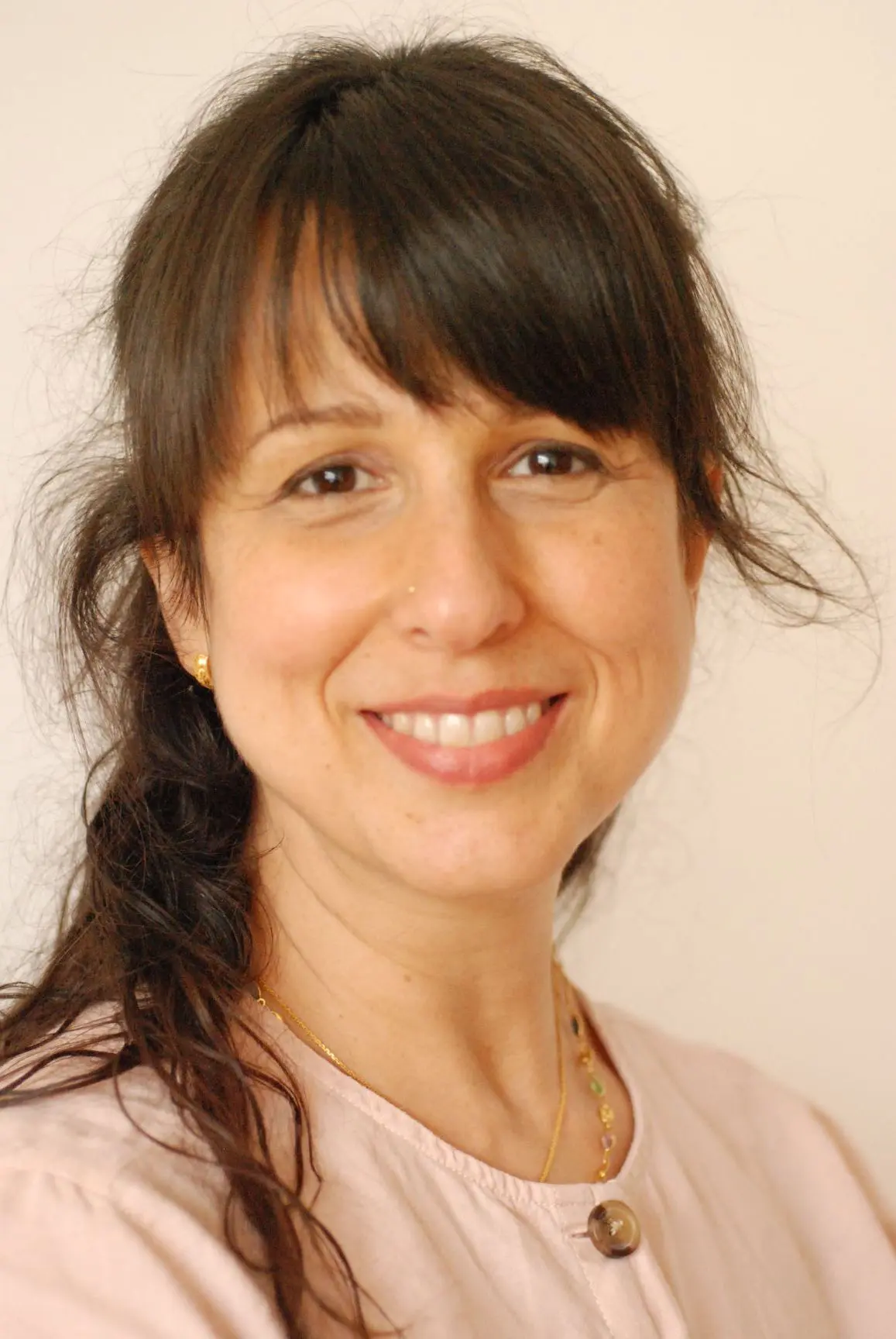 A pretty white lady who her long hair, after doing a massage feeling happy