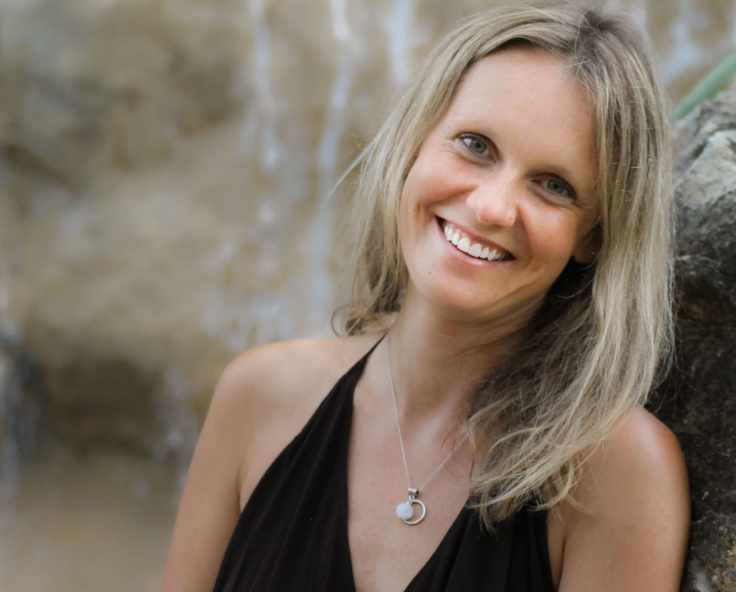 She is a sexy and attractive smile girl who her white hair and just wearing a black bra | Woman Yoga Therapy