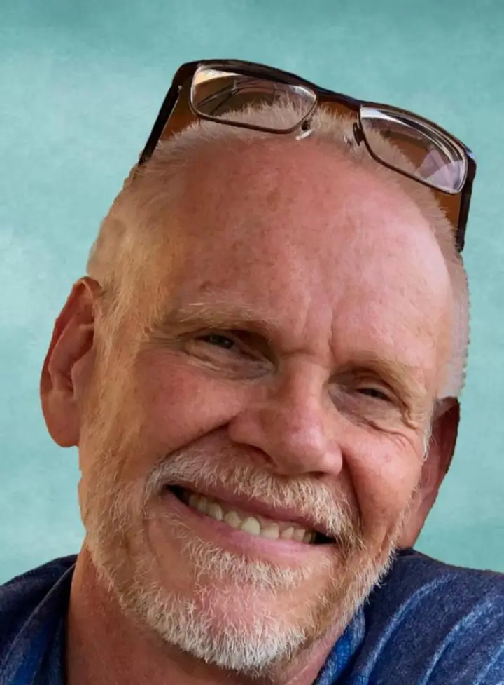 An old man at head glasses and seeing yoga class