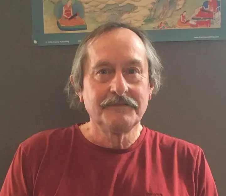 An old man yoga instructor