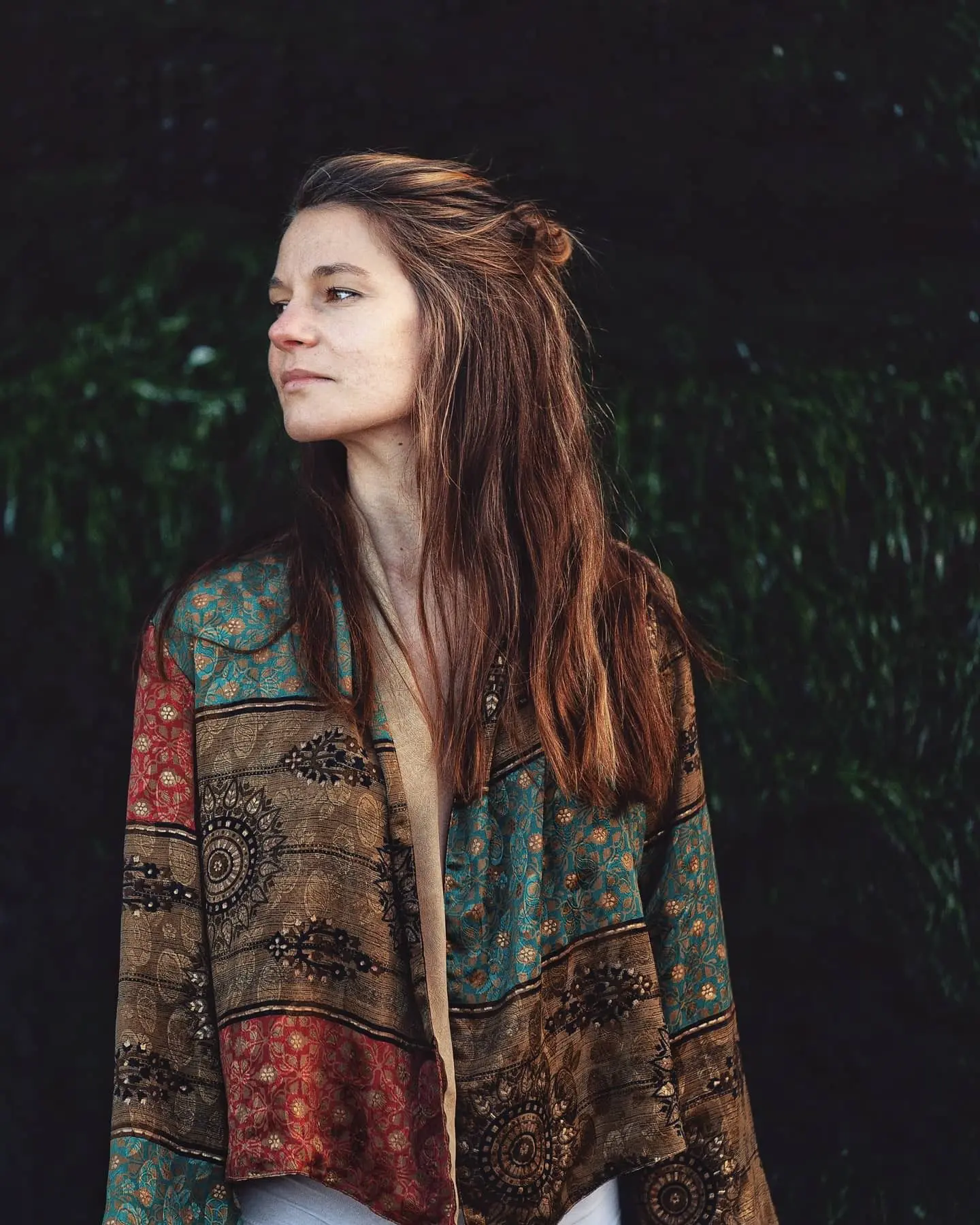 A young girl wearing massage clothes with standing in a stylish yoga pose