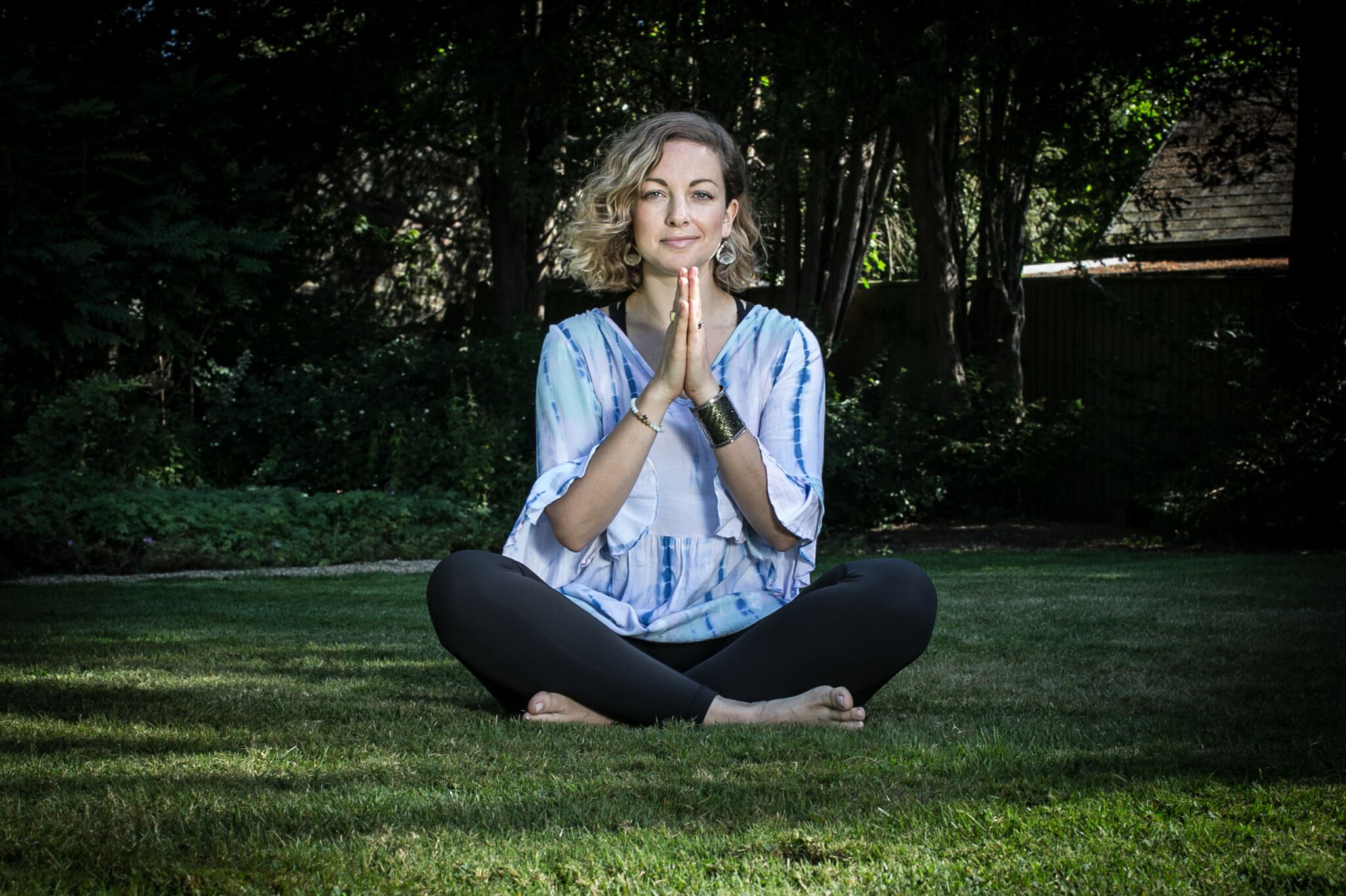 She is sitting in the Woman Yoga Therapy pose and her backside is showing multiple trees
