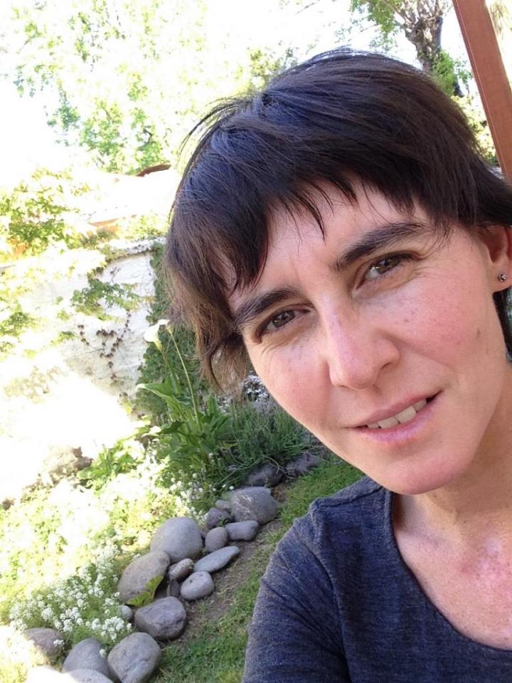 A girl making a selfie with stones and her background show Sunlight
