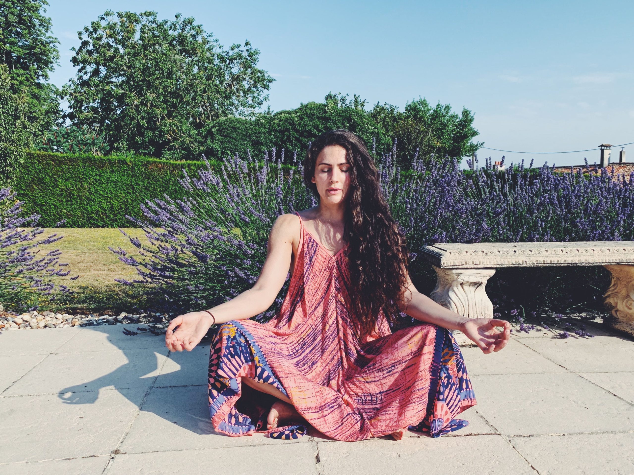 Black & Long haired young girl sitting in Easy Yoga pose