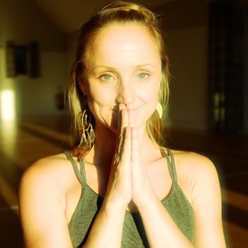 Such a beautiful Thai massage teacher standing in Praan yoga pose