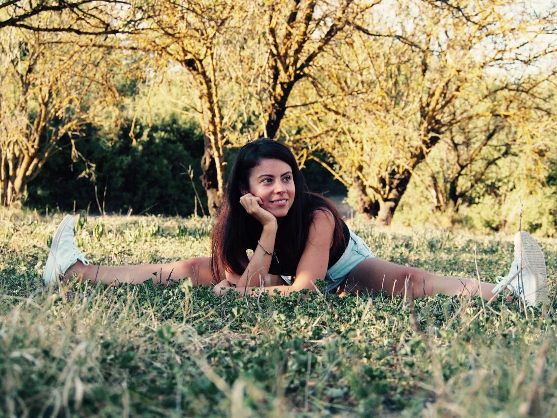 A Women Passing smile with practicing yoga, with their body twisted and their legs & arms extended