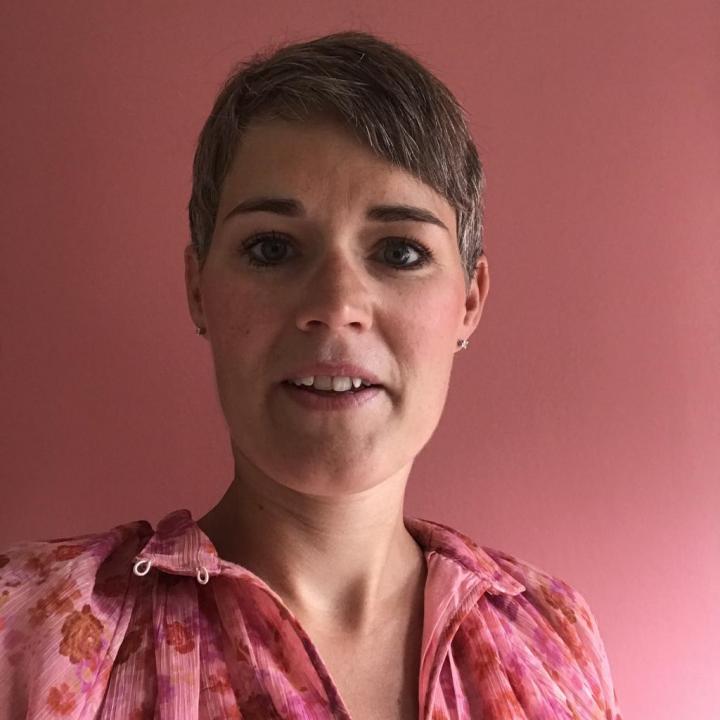 A transgender yoga instructor with little hair